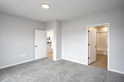 A room with two open doors leading to other rooms.