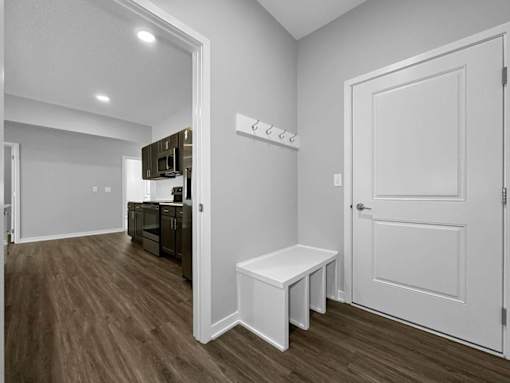 A white door is on the right side of the image.