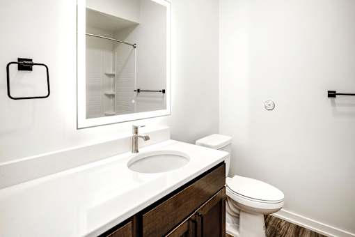 One, two and three-bedroom floor plans featuring two interior design schemes, quartz countertops, tile backsplash, stainless steel appliances, backlit mirrors, high-end finishes and more at 148 Place Apartments in Omaha, NE