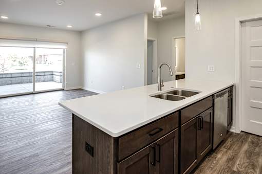 One, two and three-bedroom floor plans featuring two interior design schemes, quartz countertops, tile backsplash, stainless steel appliances, backlit mirrors, high-end finishes and more at 148 Place Apartments in Omaha, NE