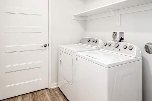 One, two and three-bedroom floor plans featuring two interior design schemes, quartz countertops, tile backsplash, stainless steel appliances, backlit mirrors, high-end finishes and more at 148 Place Apartments in Omaha, NE