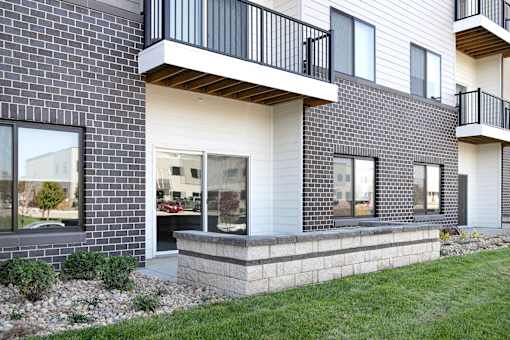 One, two and three-bedroom floor plans featuring two interior design schemes, quartz countertops, tile backsplash, stainless steel appliances, backlit mirrors, high-end finishes and more at 148 Place Apartments in Omaha, NE