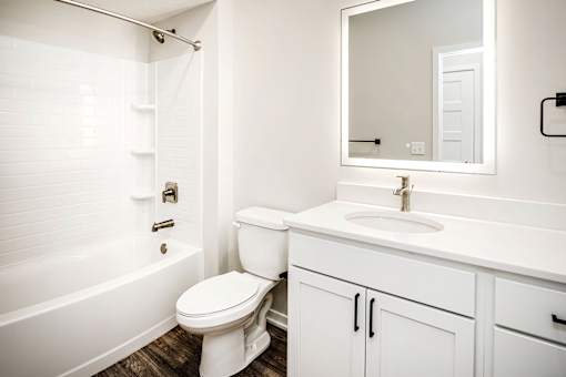 One, two and three-bedroom floor plans featuring two interior design schemes, quartz countertops, tile backsplash, stainless steel appliances, backlit mirrors, high-end finishes and more at 148 Place Apartments in Omaha, NE