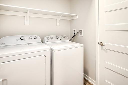 One, two and three-bedroom floor plans featuring two interior design schemes, quartz countertops, tile backsplash, stainless steel appliances, backlit mirrors, high-end finishes and more at 148 Place Apartments in Omaha, NE