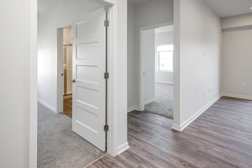One, two and three-bedroom floor plans featuring two interior design schemes, quartz countertops, tile backsplash, stainless steel appliances, backlit mirrors, high-end finishes and more at 148 Place Apartments in Omaha, NE