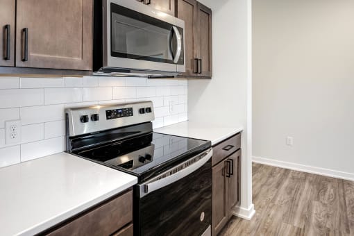 One, two and three-bedroom floor plans featuring two interior design schemes, quartz countertops, tile backsplash, stainless steel appliances, backlit mirrors, high-end finishes and more at 148 Place Apartments in Omaha, NE