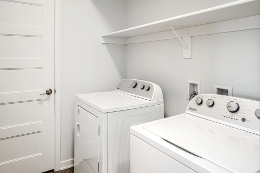 One, two and three-bedroom floor plans featuring two interior design schemes, quartz countertops, tile backsplash, stainless steel appliances, backlit mirrors, high-end finishes and more at 148 Place Apartments in Omaha, NE