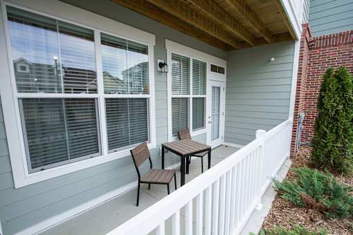 A patio with a table and chairs is shown.