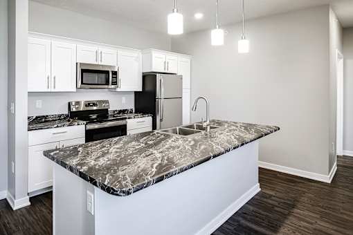 Kitchen island at Deerfield Apartments and Chateaus in Fremont, NE