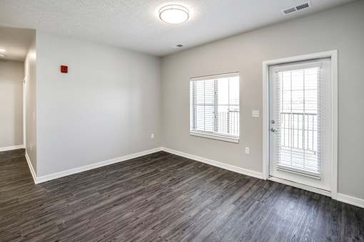 Living Room with Natural Lighting at Deerfield Apartments and Chateaus in Fremont, NE