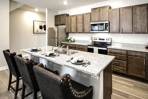 Luxury studio, one, and two bedroom apartment homes featuring granite countertops, stainless steel appliances, and fireplaces at East Lake Flats in Lincoln, NE