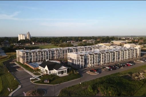 Studio, one, and two-bedroom apartment homes with stainless steel appliances, quarts countertops, designer cabinetry, large kitchens, luxury vinyl plank flooring, high vaulted ceilings, high-end lighting, in-unit washer and dryer, and energy efficient windows at Fireside at Waukee in Waukee, IA