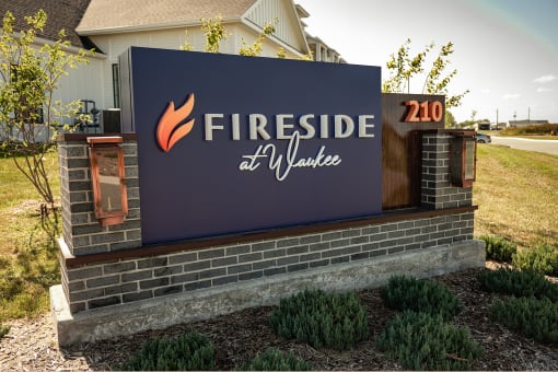 Studio, one, and two-bedroom apartment homes with stainless steel appliances, quarts countertops, designer cabinetry, large kitchens, luxury vinyl plank flooring, high vaulted ceilings, high-end lighting, in-unit washer and dryer, and energy efficient windows at Fireside at Waukee in Waukee, IA