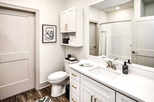 Studio, one, and two-bedroom apartment homes with stainless steel appliances, quarts countertops, designer cabinetry, large kitchens, luxury vinyl plank flooring, high vaulted ceilings, high-end lighting, in-unit washer and dryer, and energy efficient windows at Fireside at Waukee in Waukee, IA