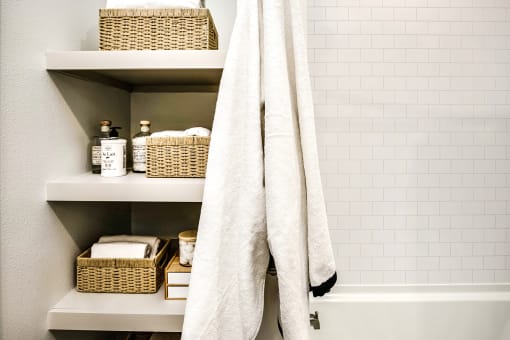 Studio, one, and two-bedroom apartment homes with stainless steel appliances, quarts countertops, designer cabinetry, large kitchens, luxury vinyl plank flooring, high vaulted ceilings, high-end lighting, in-unit washer and dryer, and energy efficient windows at Fireside at Waukee in Waukee, IA