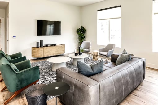 Clubhouse communal seating with TV at Hanover Flats in Bennington, NE