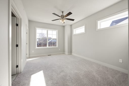 Three-bedroom townhomes featuring stainless steel appliances, premium LVT flooring, two car garage and much more at Hawthorne Row Townhomes in Bentonville, AR