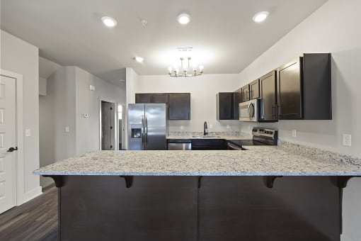 Three-bedroom townhomes featuring stainless steel appliances, premium LVT flooring, two car garage and much more at Hawthorne Row Townhomes in Bentonville, AR