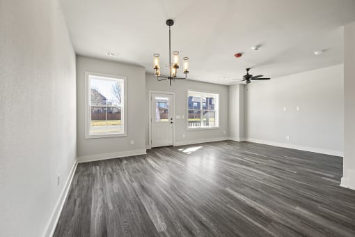 Three-bedroom townhomes featuring stainless steel appliances, premium LVT flooring, two car garage and much more at Hawthorne Row Townhomes in Bentonville, AR