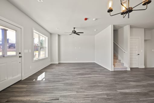 Three-bedroom townhomes featuring stainless steel appliances, premium LVT flooring, two car garage and much more at Hawthorne Row Townhomes in Bentonville, AR