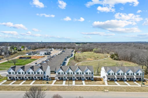 Three-bedroom townhomes featuring stainless steel appliances, premium LVT flooring, two car garage and much more at Hawthorne Row Townhomes in Bentonville, AR
