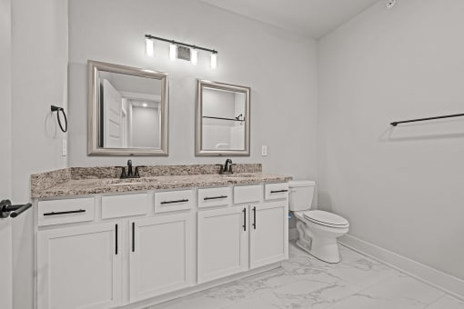 Three-bedroom townhomes featuring stainless steel appliances, premium LVT flooring, two car garage and much more at Hawthorne Row Townhomes in Bentonville, AR