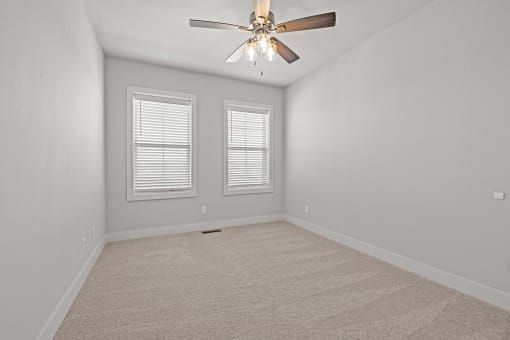 Three-bedroom townhomes featuring stainless steel appliances, premium LVT flooring, two car garage and much more at Hawthorne Row Townhomes in Bentonville, AR