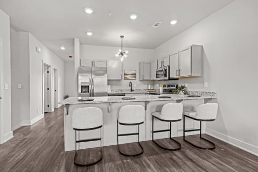 Three-bedroom townhomes featuring stainless steel appliances, premium LVT flooring, two car garage and much more at Hawthorne Row Townhomes in Bentonville, AR