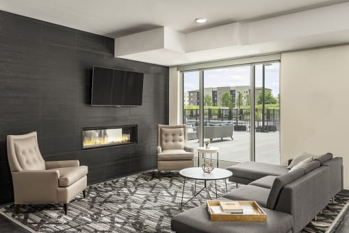 The Reverie Lounge with Fireplace and Complimentary Coffee Bar at The Nexus at Gray's Landing in Downtown Des Moines, IA