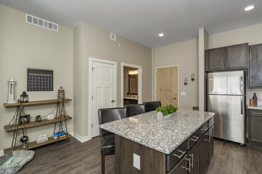 One and two bedroom hi-end apartment homes featuring Energy-Efficient Stainless Steel Appliances,  Granite Kitchen Island, dark cabinets, and much more at The Nexus at Gray's Landing in Downtown Des Moines, IA