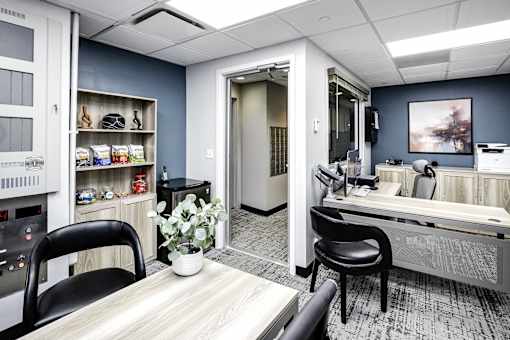 a salon room with a table and chairs and a counter