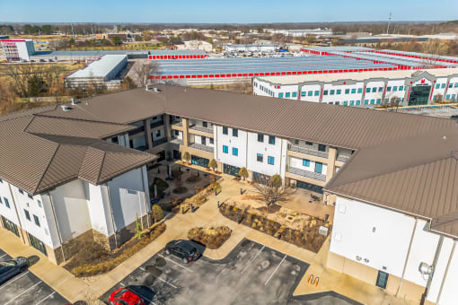 Modern clubhouse featuring community lounge, coffee bar, salon and spa, billiards and poker room, and concierge package room at Parkside Apartments and Shops in Bentonville, AR