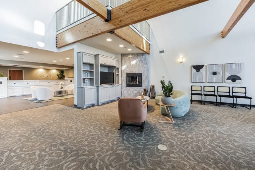 Modern clubhouse featuring community lounge, coffee bar, salon and spa, billiards and poker room, and concierge package room at Parkside Apartments and Shops in Bentonville, AR