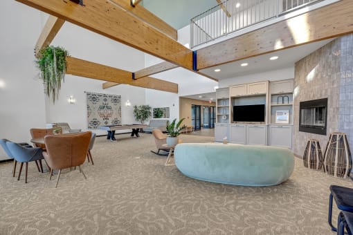 Modern clubhouse featuring community lounge, coffee bar, salon and spa, billiards and poker room, and concierge package room at Parkside Apartments and Shops in Bentonville, AR