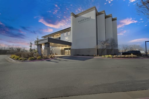 Upscale studio, one, and two-bedroom apartment homes featuring two-tone kitchen cabinetry, quartz countertops, stainless steel appliances, luxury vinyl wood flooring, and much more at Parkside Apartments and Shops in Bentonville, AR
