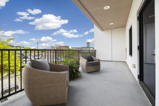 Upscale studio, one, and two-bedroom apartment homes featuring two-tone kitchen cabinetry, quartz countertops, stainless steel appliances, luxury vinyl wood flooring, and much more at Parkside Apartments and Shops in Bentonville, AR
