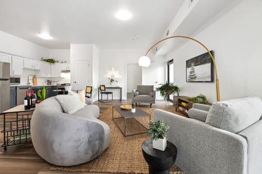 Upscale studio, one, and two-bedroom apartment homes featuring two-tone kitchen cabinetry, quartz countertops, stainless steel appliances, luxury vinyl wood flooring, and much more at Parkside Apartments and Shops in Bentonville, AR