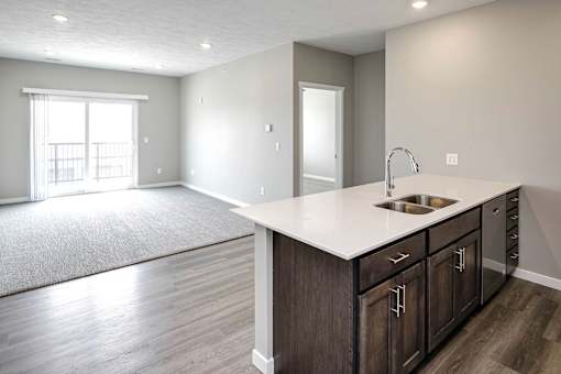 Modern kitchen with stainless steel appliances at Logan Creek Apartments in Wakefield, NE
