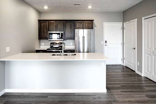 Modern kitchen with stainless steel appliances at Logan Creek Apartments in Wakefield, NE