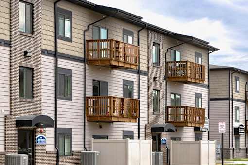 Property Exterior with Patio and Balconies at Residences at Oak Pointe in Grand Island, NE