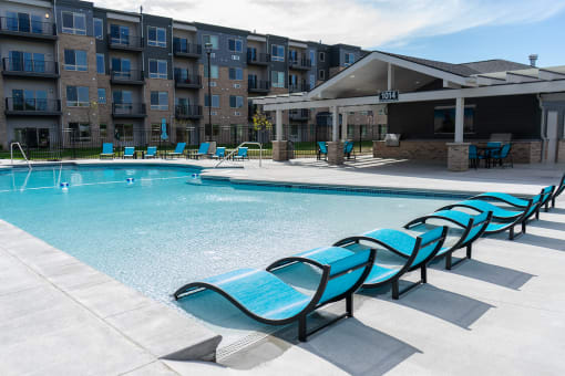 Pool with Lounge Chairs at Sterling Prairie Trail North in Ankeny, IA