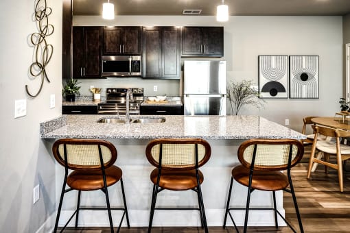 Kitchen with stunning countertops at Sterling Prairie Trail North in Ankeny, IA