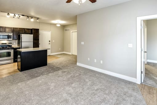 Beautiful Living Room with carpeted flooring at Tamarin Ridge in Lincoln, NE