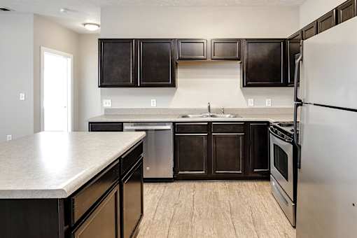 Kitchen with stainless steel appliances at Tamarin Ridge in Lincoln, NE