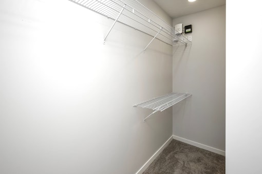 Spacious one and two-bedroom apartments featuring three interior schemes, granite countertops, stainless steel appliances, large kitchens, high-end lighting, vinyl plank flooring and much more at The Brink at Ridgeview in Plattsmouth, NE