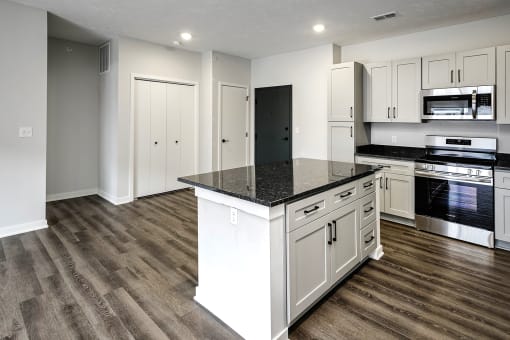 Spacious one and two-bedroom apartments featuring three interior schemes, granite countertops, stainless steel appliances, large kitchens, high-end lighting, vinyl plank flooring and much more at The Brink at Ridgeview in Plattsmouth, NE
