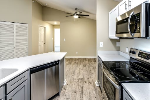 Kitchen with stainless steel appliances at The Vue Apartments, Nebraska