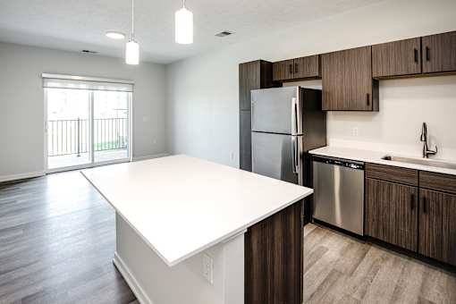 Studio, one two and three bedroom apartments and townhomes featuring open concept floor plans, dens, large windows, stainless steel appliances, quartz countertops, eat-in kitchens, pantries, LVT flooring and much more at The Trails at North Streams in Omaha, NE