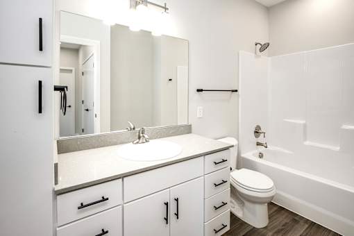 Studio, one two and three bedroom apartments and townhomes featuring open concept floor plans, dens, large windows, stainless steel appliances, quartz countertops, eat-in kitchens, pantries, LVT flooring and much more at The Trails at North Streams in Omaha, NE