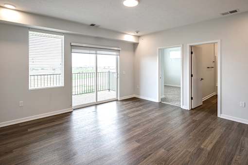 Studio, one two and three bedroom apartments and townhomes featuring open concept floor plans, dens, large windows, stainless steel appliances, quartz countertops, eat-in kitchens, pantries, LVT flooring and much more at The Trails at North Streams in Omaha, NE